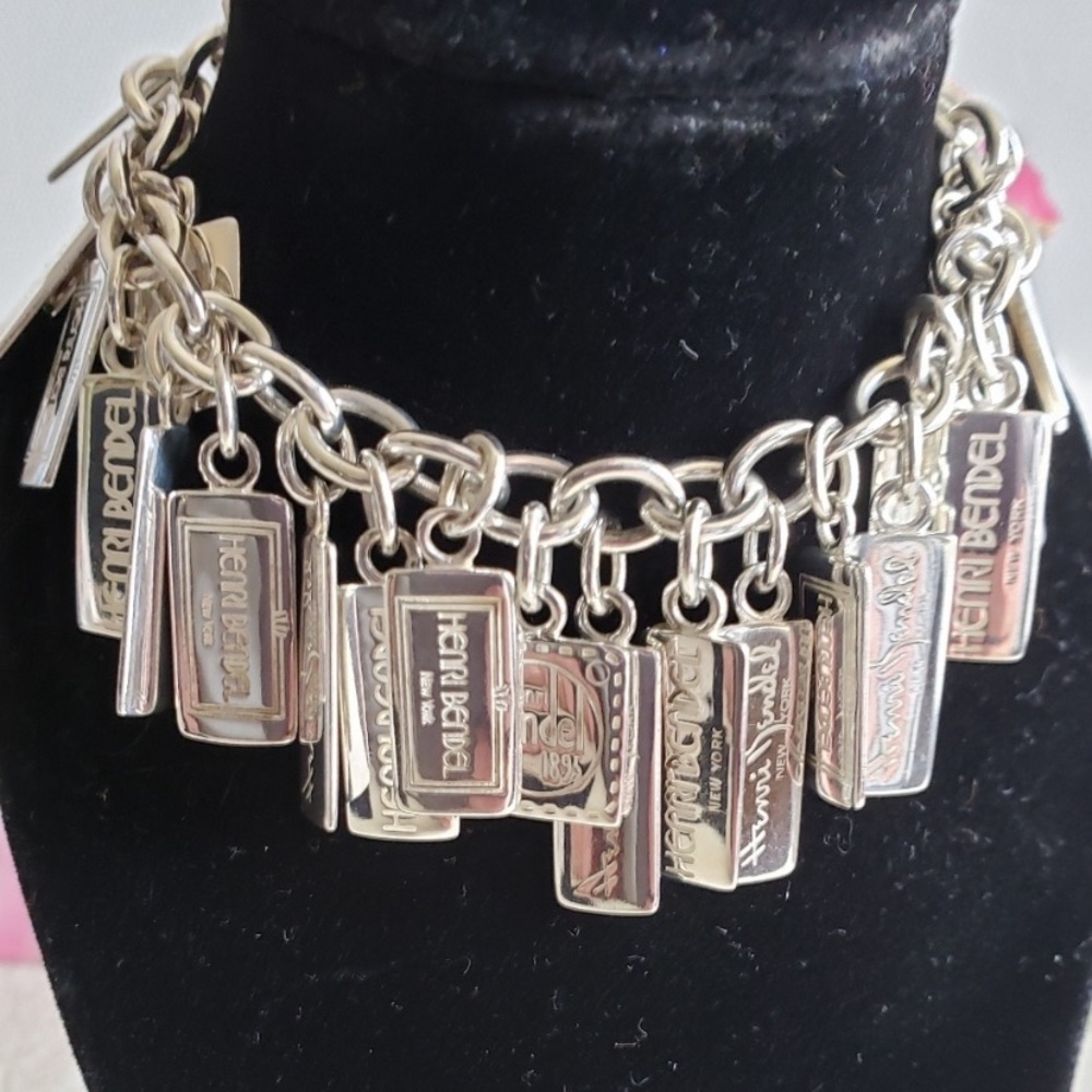 ISO IN SEARCH OFF HENRI BENDEL STERLING SILVER CHARM BRACELET